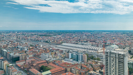 Obraz premium Milan aerial view of residential buildings and the central railway station in the business district timelapse