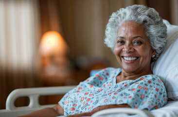 Happy senior african american woman recovering in the hospital bed. Copy space