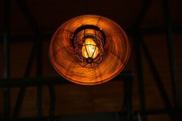 Orange vintage lamp In a modern cafe, There is space for text.