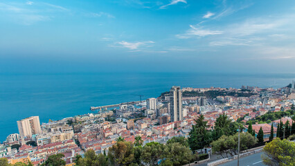 Cityscape of Monte Carlo, Monaco day to night timelapse with roofs of buildings after summer sunset.