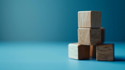 Stacked Wooden Blocks on Blue