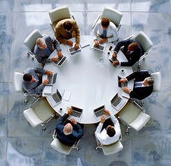 a group of men sitting around a round table