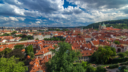 Panorama of Prague Old Town with red roofs timelapse, famous Charles bridge and Vltava river, Czech...