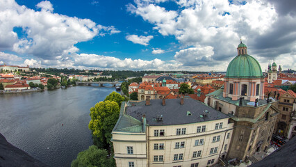 Panoramic view of the manes bridge with a building of the czech parliament behind it timelapse from...