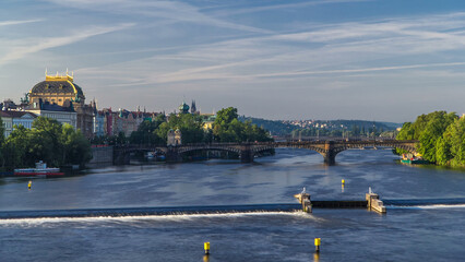 Vltava river timelapse in district Strelecky ostrov with the bridge of the Legions and National...