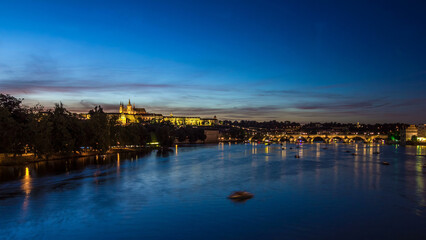 View of the city Prague in Czech Republic day to night timelapse on the Vltava river with beautiful sky