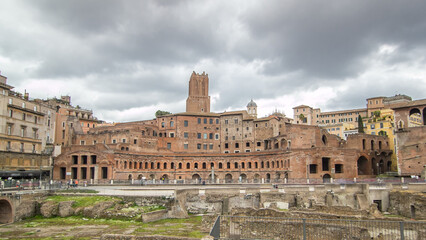 Fototapeta na wymiar A panoramic view on Trajan's Market timelapse hyperlapse on the Via dei Fori Imperiali, in Rome, Italy