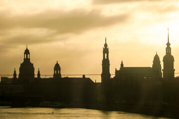 Silhouette of the Baroque roofs and towers of the old town of Dresden in Germany at Dawn.