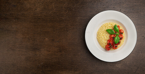 Ptitim, Israeli couscous, on a wooden background, top view, copy space