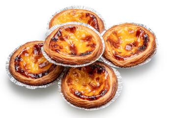 Pastel de nata tarts in foil cups on white background.  File contains clipping path.