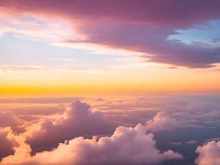 Fototapeta premium Dramatic amazing sky and clouds from above at sunset. Colorful pastel sky