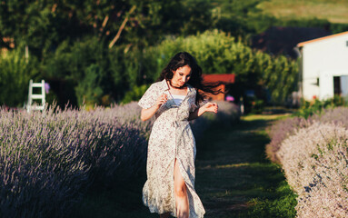  young woman in a blooming lavender field