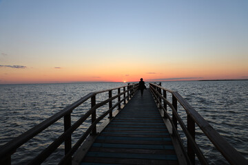 Fototapeta na wymiar Pier in the setting sun