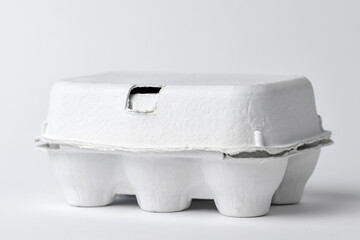 white egg box with lid on white
