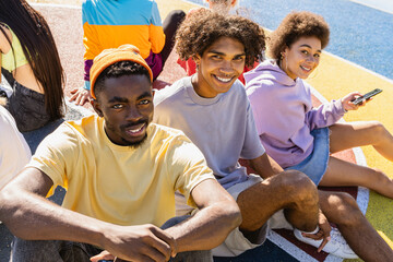 Multiracial group of young friends bonding outdoors