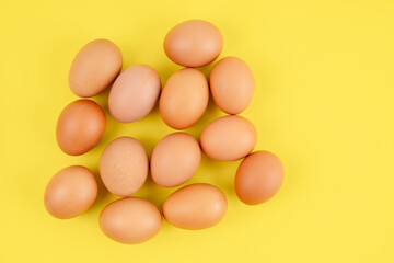 The Fresh eggs on yellow background, Position with copy space.