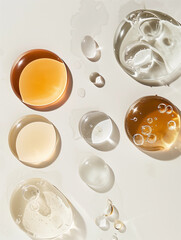 Flatlay beauty skincare serum liquid round drops on white background anti ageing skin beauty product campaign ad close-up natural brown clear droplets vitamin a c peptides collagen retinal