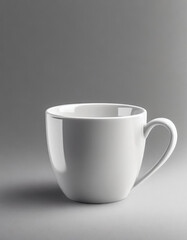 Close-up of ceramic white cup on isolated gray background. Tea or coffee mug. Drink ware. Mock up.