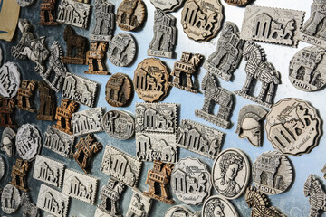 Varied collection of magnet souvenirs from Canakkale, featuring ancient motifs and inscriptions,...
