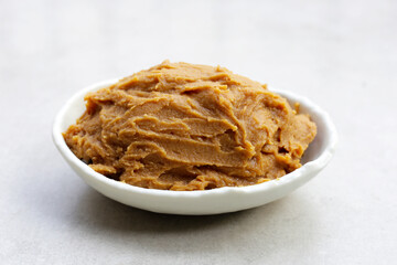 Japanese miso paste on white background.
