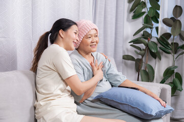 Happy senior woman with breast cancer after chemotherapy spend free time with daughter, elderly...