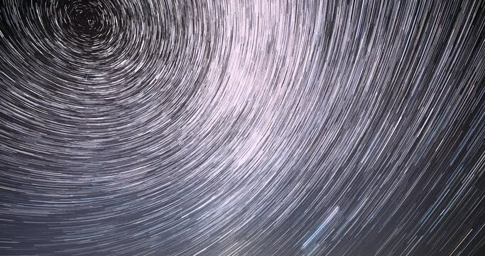Rotate Of Sky Background. Large Exposure. 4k Hyperlapse Trails Of Stars. Spin Of Unusual Amazing Stars Effect In Sky. Bewitching Illusion Of Star Trails. Star And Meteoric Trails On Night Sky