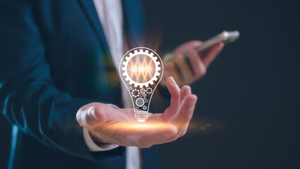 Creative businessman holds a light bulb representing a bright idea innovation