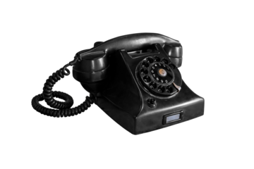 The old dial phone is dirty and scratched