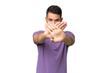 Young handsome caucasian man over isolated background making stop gesture with her hand to stop an act