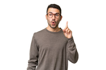 Young handsome caucasian man over isolated background intending to realizes the solution while lifting a finger up