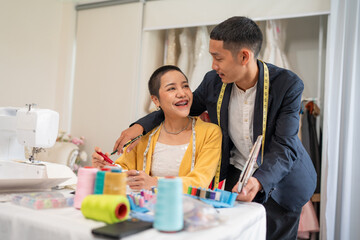 Fashion design concept, young stylish woman fashion designer working in studio office, small business owner creating new fashion design cloth in atelier.