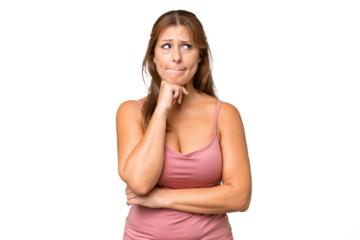 Middle-aged caucasian woman over isolated background having doubts and thinking