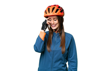 Young cyclist woman over isolated chroma key background laughing