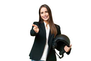 Young Asian woman with a motorcycle helmet over isolated chroma key background shaking hands for...