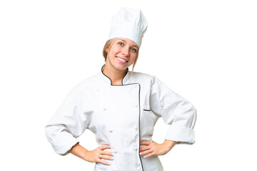 Young chef woman over isolated chroma key background posing with arms at hip and smiling