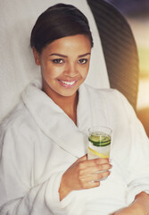 Woman, relax and smile at spa with water on holiday, break and luxury or mindfulness in portrait. Female person, resort and happy with healthy drink on vacation, trip and travel for wellness at hotel