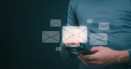 businessmen use their mobile phones to check newsletters or emails each day. For communication or...