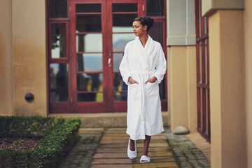 Outdoor, woman and walking at spa on holiday, relax and break for luxury and mindfulness. Female...
