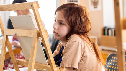 Cute girl in art studio painting oil painting. Hobbies, Relaxation, Art Therapy