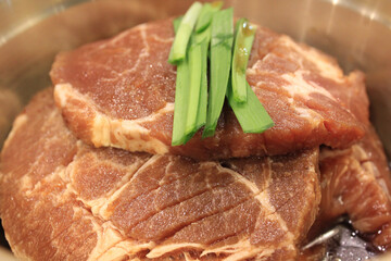 raw meat on a bowl