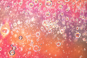 Abstract colorful background with oil on water surface. Oil drops in water abstract psychedelic.