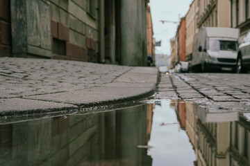 Close up of a puddle on a city street