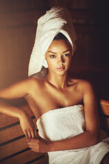 Woman, portrait and relax in spa sauna with towel for self care, health and skincare or beauty....