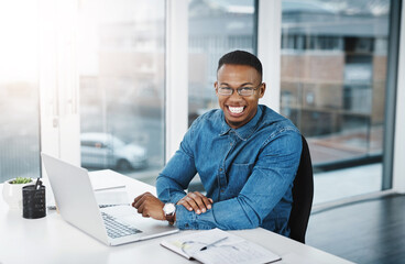 Portrait, working and black man by computer in office, workspace and desk happy in creative career. Happiness, internship and journalist with tech for typing, research and internet for productivity