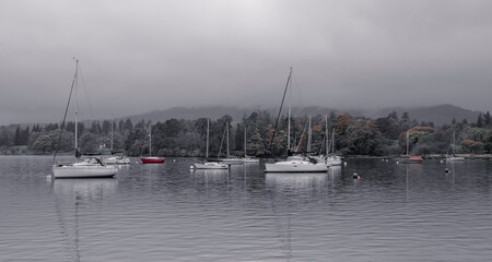 Fototapeta na wymiar misty morning boats on lake