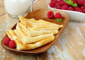 thin pancakes for breakfast with fresh berries