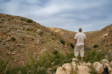 A Hiker on a Cliff Overlooking the Prat Stream, Israel