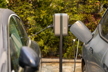 Electrical cars charging station. Close up photo with a high power socket attached to an electrical...