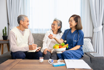 home health care nurse advice healthy organic food to asian senior couple,they are smile and a husband take notes,concept of elderly health care,home health care,healthy eating,wellness  