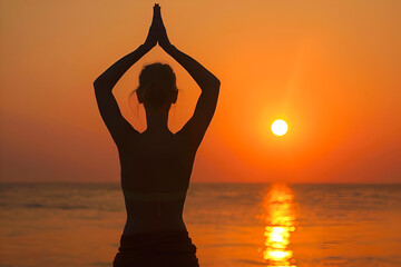 Woman doing yoga on a beach